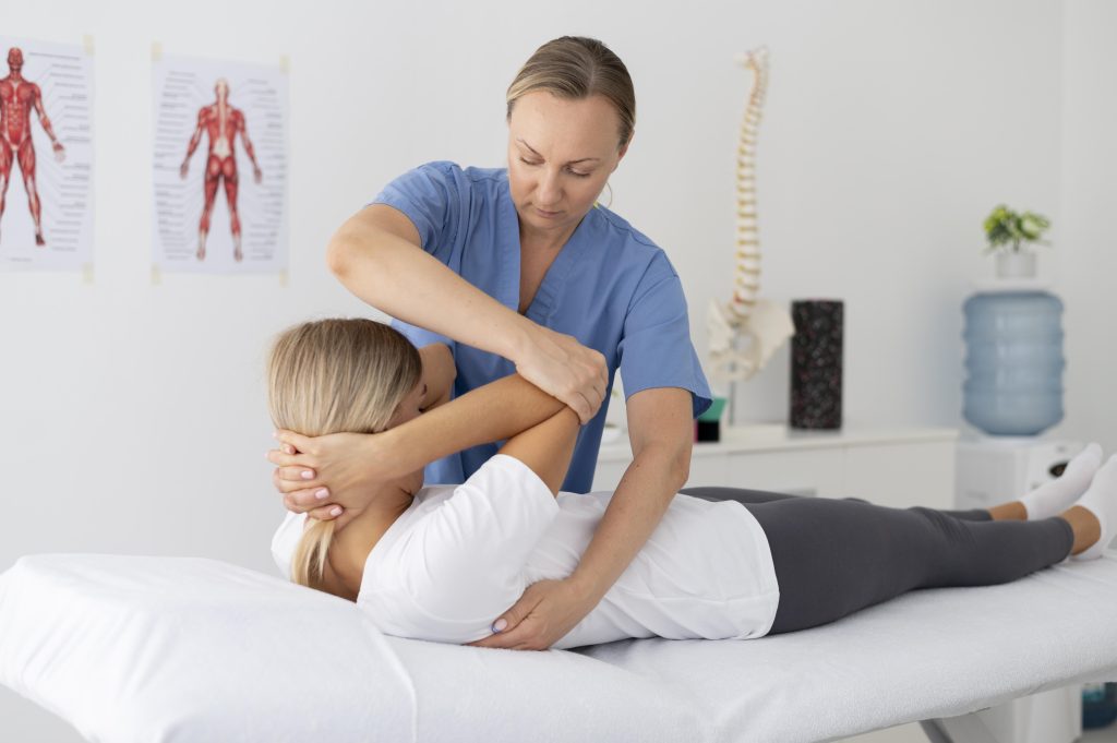 Physiotherapy Cost in Dhaka 3 physiotherapist helping young female patient 2 Physiotherapy Cost in Dhaka
