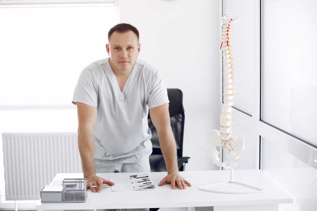 doctor white uniform office Vertebral Compression Fractures: A Complete Guide
